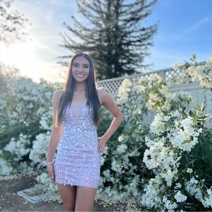 Size 2 short formal dress. Super fun with so much going on.